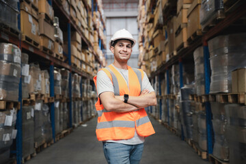 Portrait male working staff in safety suite smiling at logistic storage warehouse