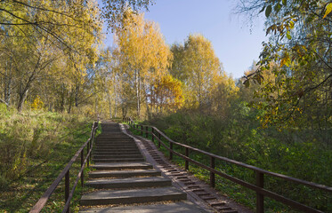 Fototapeta na wymiar Staircase on a pedestrian walkway on the slope of the ravine.