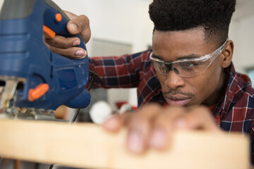 carpenter working on an electric buzz saw