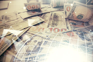 Double exposure of world map drawing over us dollars bill background. International concept.