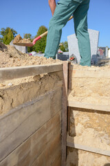 gravedigger digging in the cemetery