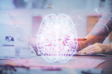 Multi exposure of woman hands working on computer and brain hologram drawing. Ai concept.