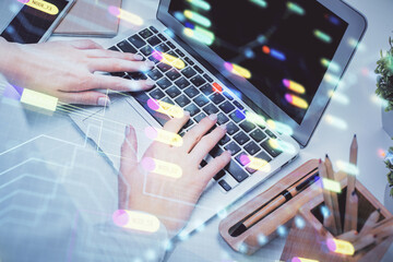 Double exposure of woman hands working on computer and data theme hologram drawing. Tech concept.