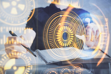 Double exposure of man hands holding a credit card and tech theme drawing. Technology in E-commerce concept.