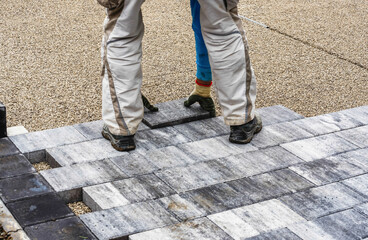 paving blocks. worker are installing  paving blocks
