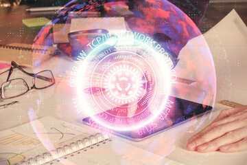 Double exposure of man's hands holding and using a digital device and tech theme hologram drawing. Technology concept.