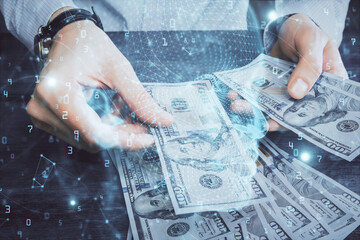 Multi exposure of brain drawing hologram and us dollars bills and man hands. Ai invest concept