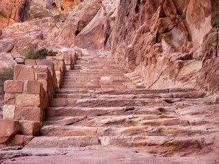 View with the Al-Khubtha Trail stone stairs that leads to the Treasury Viewpoint in the ancient...