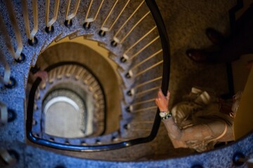 people climbing spiral staircase