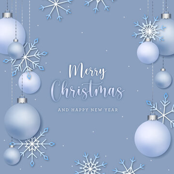 White Christmas snowy postcard with snowflakes and balls on a light blue background