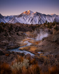 Beautiful Sunrise with Snow covered mountain in fall color season at Hot Creek Panorama, Mammoth  Lakes, California