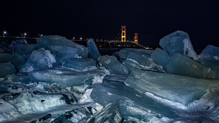 Night descends over Blue Ice blocks piling up at the Mackinac Bridge, near Mackinaw City, Michigan.