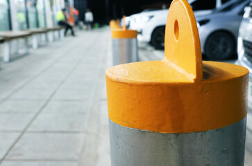 Security steel bollards installed in the parking lot at night.	