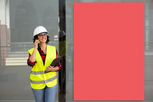 female worker talking on the phone smiling