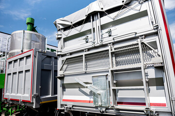 Large grain trucks at the blue sky background