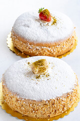 Strawberry and banana german cakes on a white background
