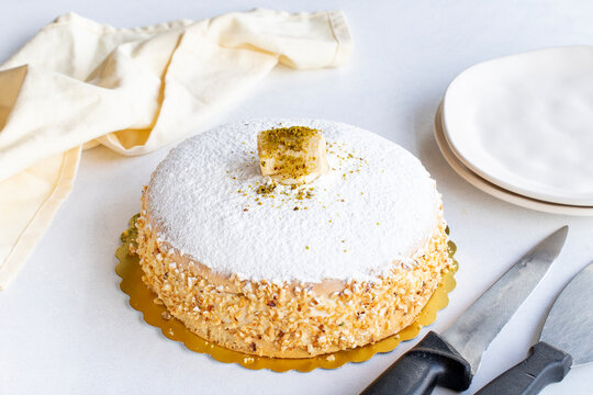 Banana cake on a white background. German cake filled with cream and banana