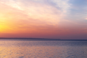 Fototapeta na wymiar sunrise on the water / Early summer morning bright sky Beach