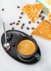 Fresh espresso coffee with coffee beans on white marble background