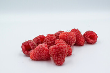 Raspberries on a white background