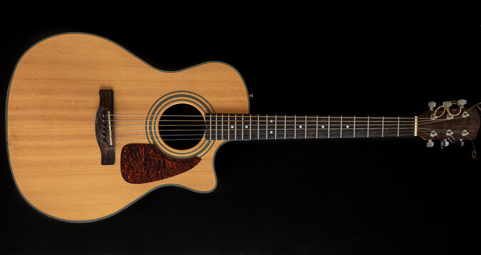 Classical Acoustic Guitar On A Black Background.