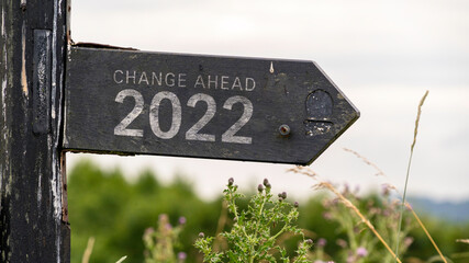 Change Ahead 2022 written on a wooden sign