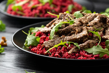 Bulgur salad with beetroot and roast beef. Healthy diet food