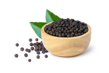Black pepper seeds or peppercorns (dried seeds of piper nigrum) in wooden bowl with green leaf isolated on white background.