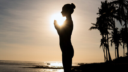 beautiful woman meditating outdoors.