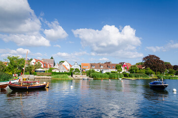 Fototapeta na wymiar Boat at the Schlei river in Holm village of Schleswig, Germany