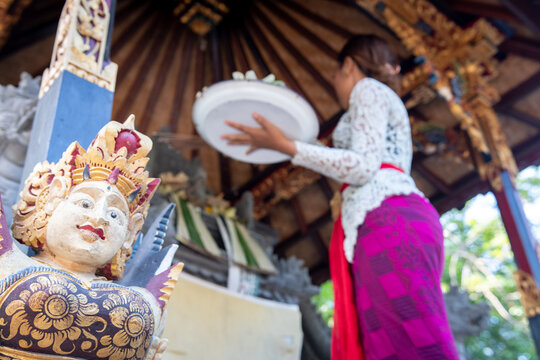 Young Balinese girl praying at Hindu Temple, Bali