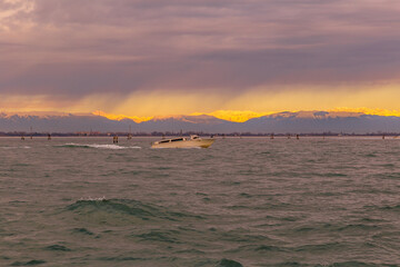 Venetian lagoon and in the background the snow-capped peaks of the Alps