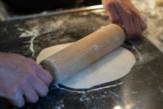 Man Making Tex-Mex Food Such As Burritos, Enchiladas, Tacos Etc. Close-up, Selected Focus, Blurry