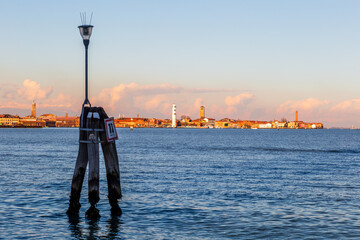 Fototapeta na wymiar Venetian lagoon at dawn, in the background the island of Murano, Italy