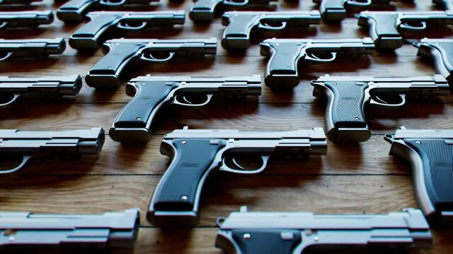 Seamless looping animation of pistols. Shiny guns. Munition depot. Gun store.