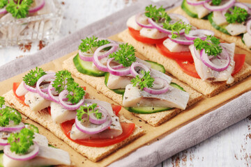 Sandwiches with herring and vegetables	
