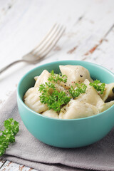 Russian national dish pelmeni served in a plate