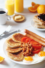 Traditional British breakfast with sausages and beans