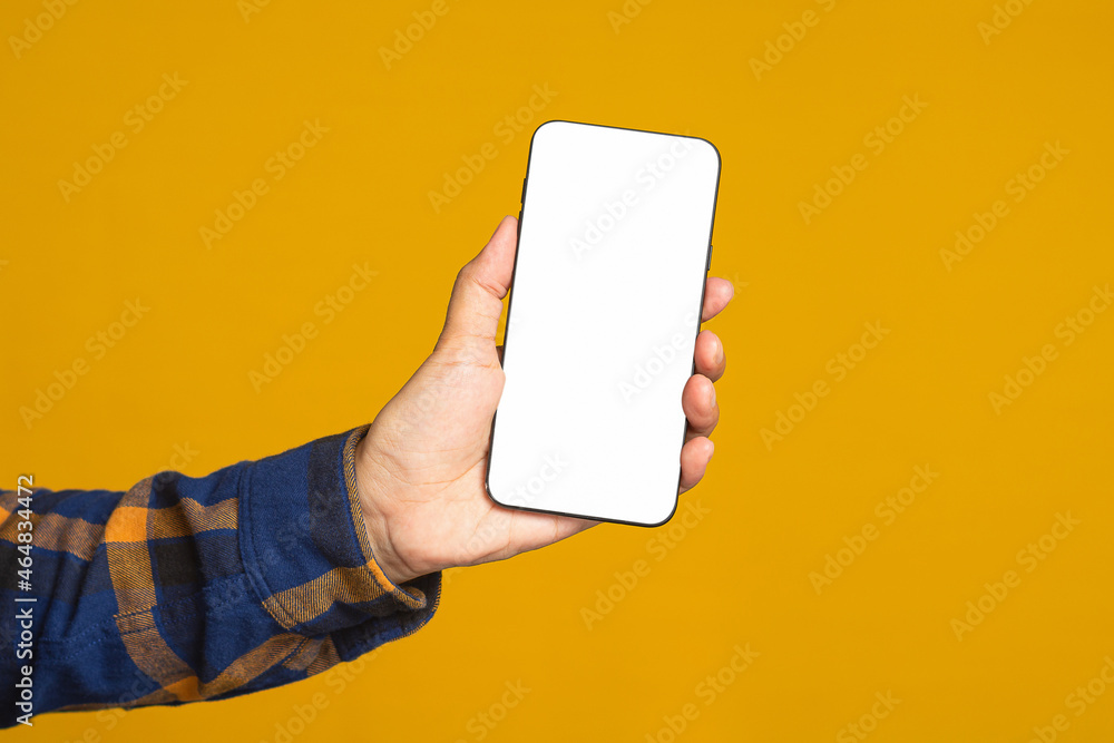 Poster technology, communication, and advertising concept. close-up of hand holding a smartphone with blank