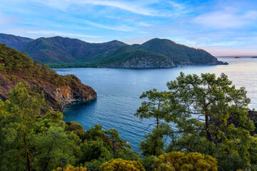 Fototapeta na wymiar Cirali, Antalya province, Turkey. Picturesque landscape before sunrise, view of the bay with turquoise clear water from lycian trail.