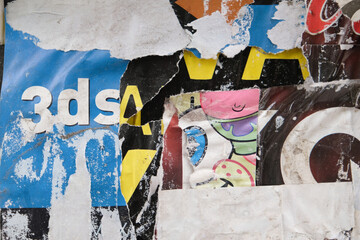 Fototapeta premium Torn street poster background. Retro weathered paper texture.
