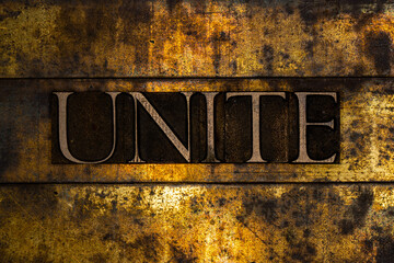 Unite text on textured grunge copper and vintage gold background