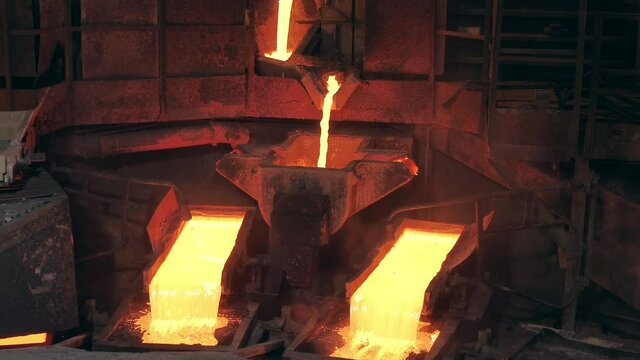 Factory smelter with molten copper flowing through it