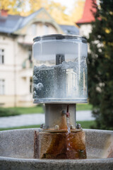 Public natural healing mineral water, spring with mineralized water in spa town Luhacovice, Czech Republic