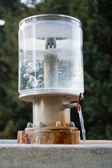 Public natural healing mineral water, spring with mineralized water in spa town Luhacovice, Czech Republic