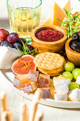 Cheese Platter or Cheese Board with Fruits, HErbs, Honey and Crackers
