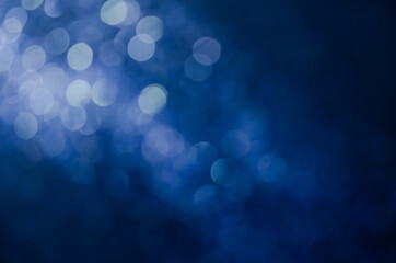 abstract blue bokeh glitter sparkle background.