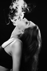 woman blowing smoke