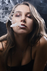 woman blowing smoke