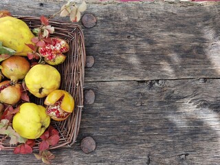 wood old for background autumn fruits quinces pomegranates